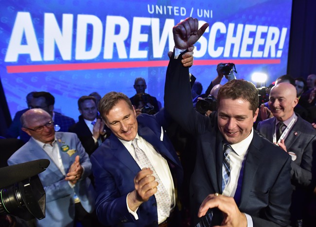 Andrew Scheer, right, is congratulated by Maxime Bernier after being elected the new leader of the federal Conservative Party last week.