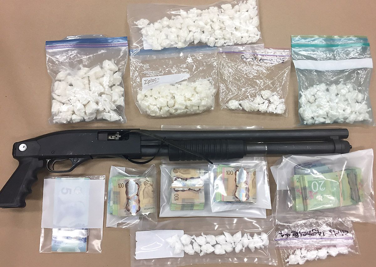 Police seize a gun and drugs in Fort McMurray, Alta. May 16, 2017. 