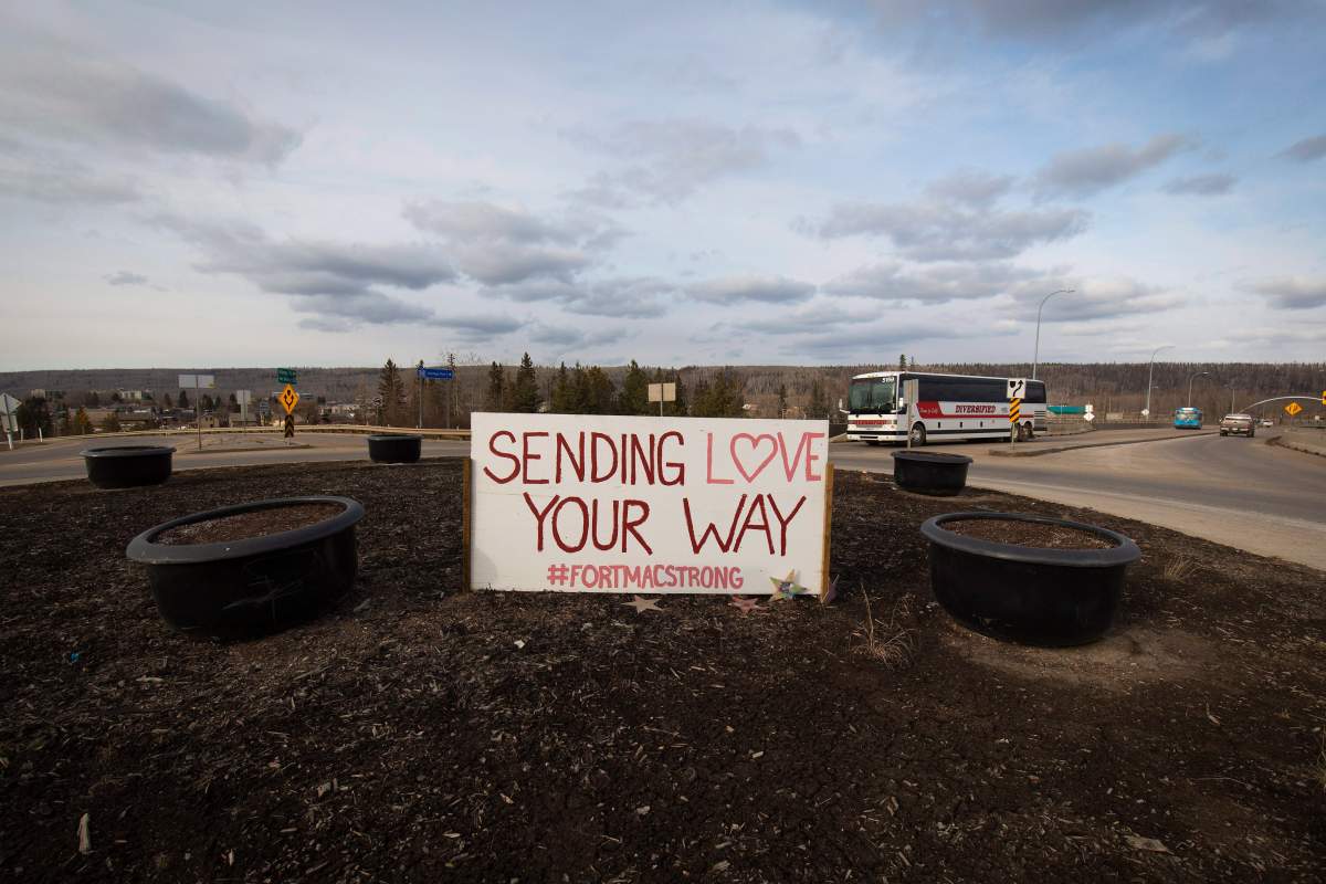 After wildfires destroyed part of the city last year a welcoming sign sits greeting people as they enter Fort McMurray, Alta. Friday, April 21, 2017.