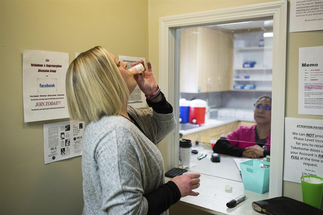 A person in addiction treatment takes a dose of methadone.