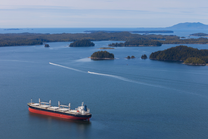 The North Coast of British Columbia near Prince Rupert with a cargo ship in the protected harbour..  The region is famous for its natural beauty and abundant wildlife.