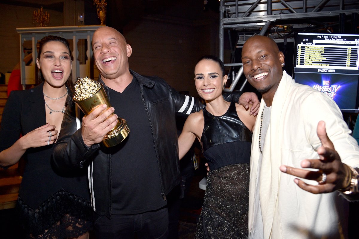  (L-R) Actor Gal Gadot poses with actors Vin Diesel, Jordana Brewster, and Tyrese Gibson, who accepted the MTV Generation Award on behalf of 'The Fast and the Furious' franchise, backstage during the 2017 MTV Movie And TV Awards at The Shrine Auditorium on May 7, 2017 in Los Angeles, California.