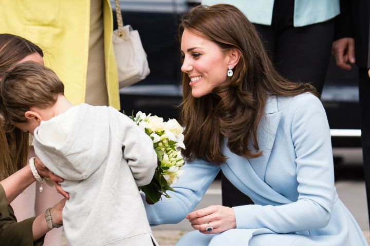 Catherine, Duchess of Cambridge receives flowers from a boy at Place Clairefontaine during a visit to Luxembourg on May 11, 2017 in Luxembourg.
