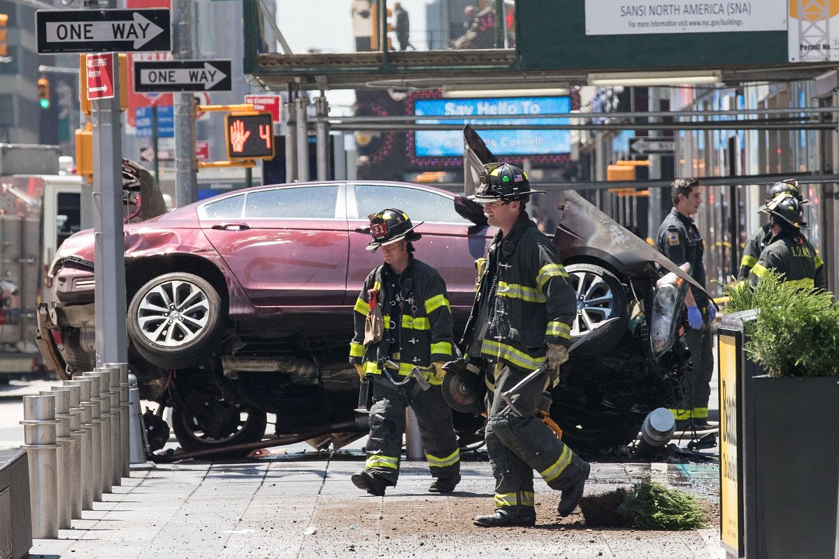 NEW YORK, NY - MAY 18: A wrecked car sits in the intersection of 45th and Broadway in Times Square, May 18, 2017 in New York City. According to reports there were multiple injuries and one fatality after the car plowed into a crowd of people. (Photo by Drew Angerer/Getty Images).