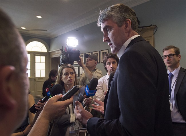 Nova Scotia Premier Stephen McNeil talks with reporters at the legislature in Halifax on Wednesday, May 31, 2017.