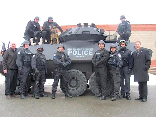 If you're in the market for a large, tank-like vehicle, the Nova Scotia town of New Glasgow has a deal for you.The town's police chief says he wants to give away the department's Cougar light-armoured vehicle, shown in a handout photo, which was a gift from the former local MP, Peter MacKay (bottom right), when he was defence minister. 