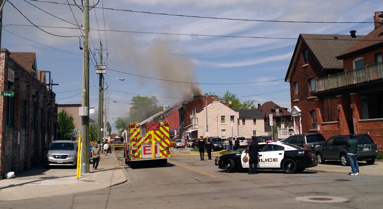 Firefighters are battling a house fire in downtown Hamilton.