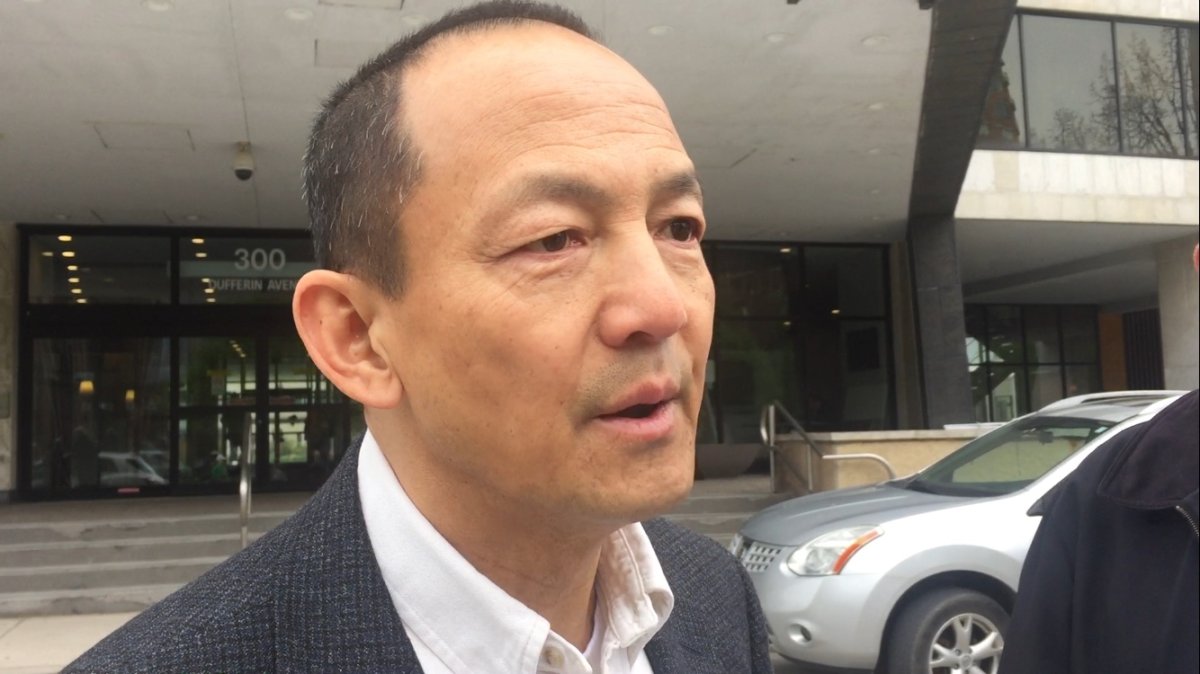 London businessman Paul Cheng addresses reporters outside City Hall on May 12, 2017 to announce his bid for the 2018 mayoral election.