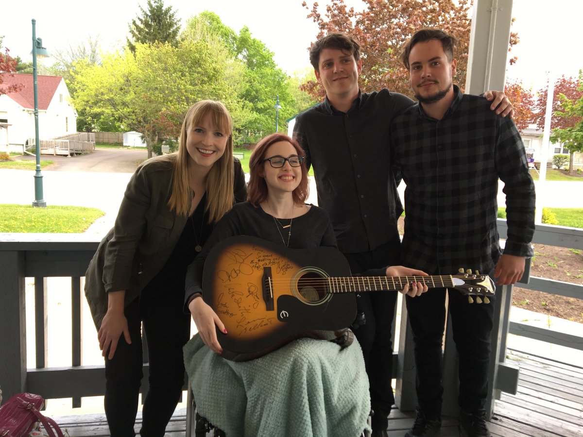 Becca Schofield, second left, is pictured with members of her favourite band Port Cities.
