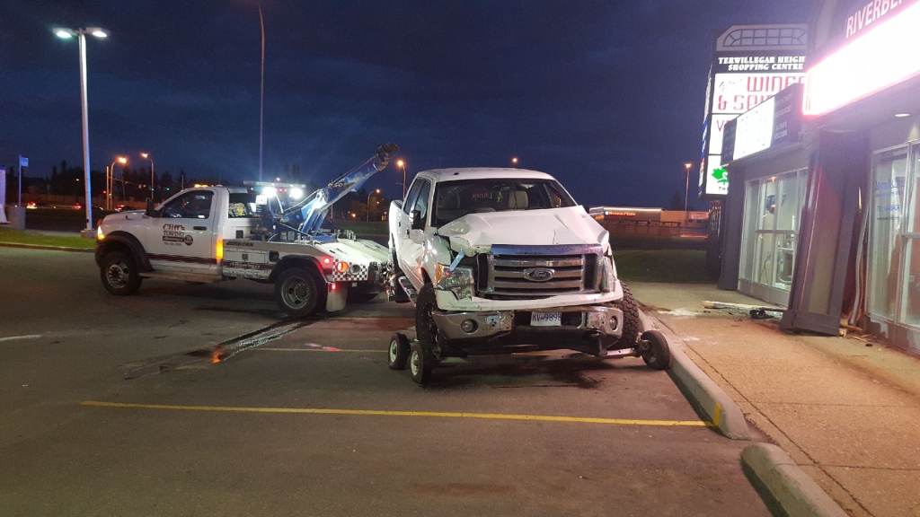 Teen charged after truck plows into Edmonton dental clinic - Edmonton ...