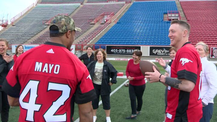 Stampeders linebacker Deron Mayo and QB Bo Levi Mitchell teaching ladies some offense.