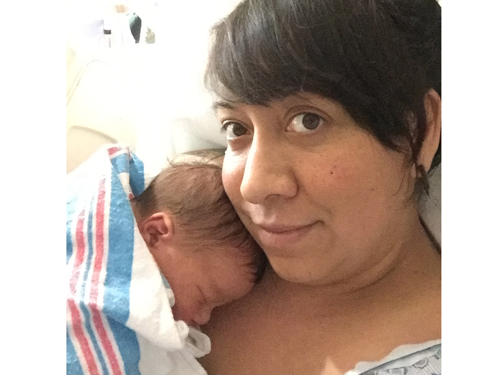 ‘Mirena baby’ photographed clutching his mother’s IUD after birth - image