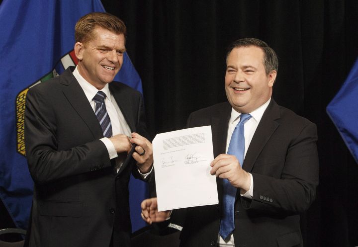 Alberta Wildrose leader Brian Jean, left, and Alberta PC leader Jason Kenney announce a unity deal between the two in Edmonton on Thursday, May 18, 2017.