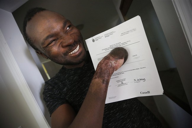 A man who lost all ten of his fingers crossing the border into Manitoba this winter has been granted the right to stay as a refugee.