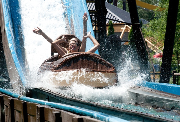 In this 2010 file photo, a La Ronde patron riding in La Pitoune, shows a sign of relief, during a heatwave along the eastern seaboard. After 50, years, the amusement park announced the ride would not be open for the 2017 season. Sunday, May 28, 2017.