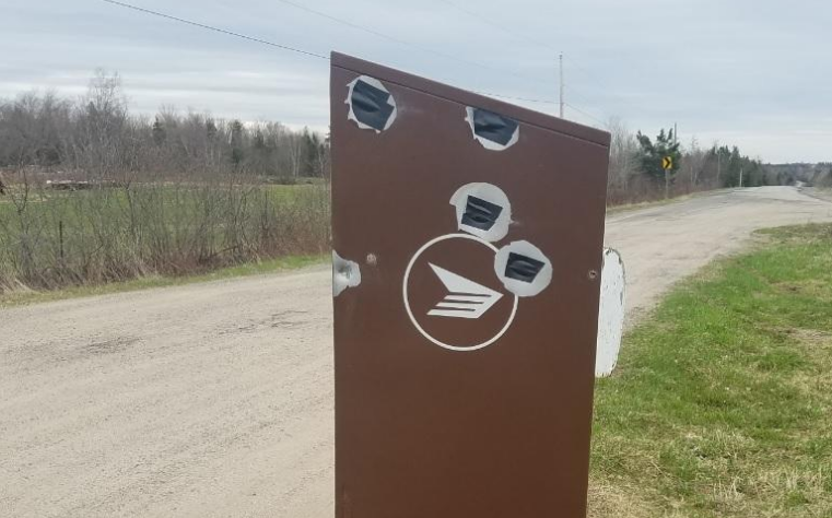 New Brunswick RCMP are looking for information about those involved in the shooting of this community mailbox.