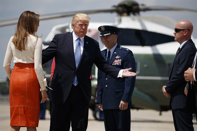 President Donald Trump and first lady Melania Trump with Col. Casey D. Eaton, Commander, 89th Airlift Wing, Andrews Air Force Base prepares to board Air Force One at Andrews Air Force Base, Md., Friday, May 19, 2017, for his first international trip as president.