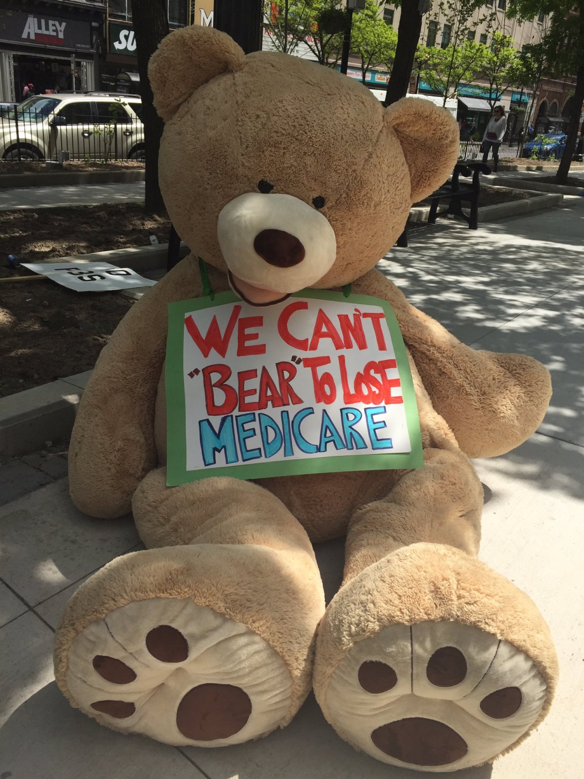 Ontario Health coalition brings giant teddy bear on Medicare tour.