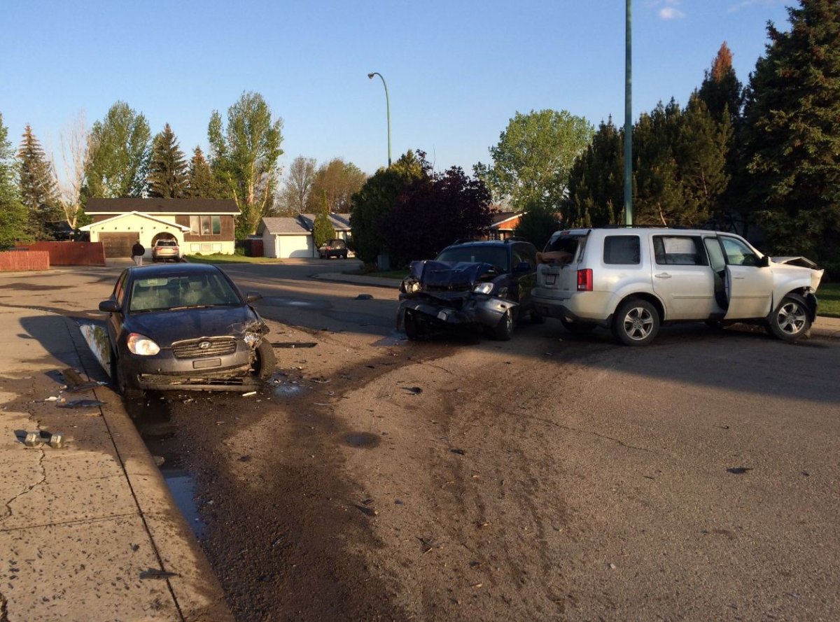 Moose Jaw Police arrest man after stolen Alberta vehicle was crashed into two parked cars.