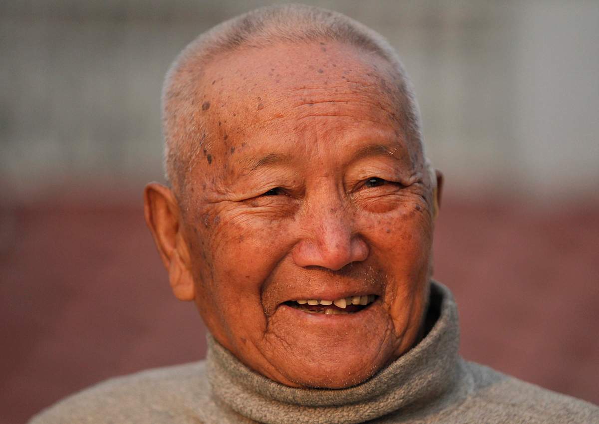 In this April 12, 2017 file photo, Nepalese mountain climber Min Bahadur Sherchan, 85, smiles as he finishes his morning yoga workout at his residence in Kathmandu, Nepal. 