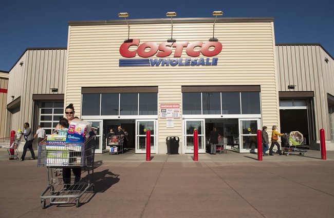 Customers push shopping carts at Costco in Mississauga, Ont., on Monday, May 15, 2017. While international retailers Costco and Walmart have gobbled up a growing share of Canadian food sales for more than a decade, further gains are expected to be tougher to eke out as the country's traditional grocers mount an improved defence.