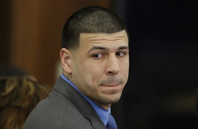 New England Patriots tight end Aaron Hernandez turns to look in the direction of the jury as he reacts to his double murder acquittal after the sixth day of jury deliberations at Suffolk Superior Court in Boston on April 14, 2017.