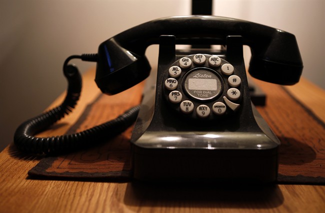 This Wednesday, April 14, 2016, file photo, shows a push-button landline telephone, in Whitefield, Maine.