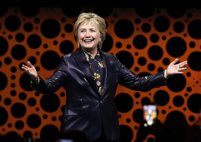 Former Secretary of State Hillary Clinton gestures while speaking before the Professional Businesswomen of California in San Francisco.