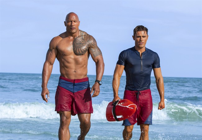 Dwayne Johnson as Mitch Buchannon, left, and Zac Efron as Matt Brody in 'Baywatch.'.