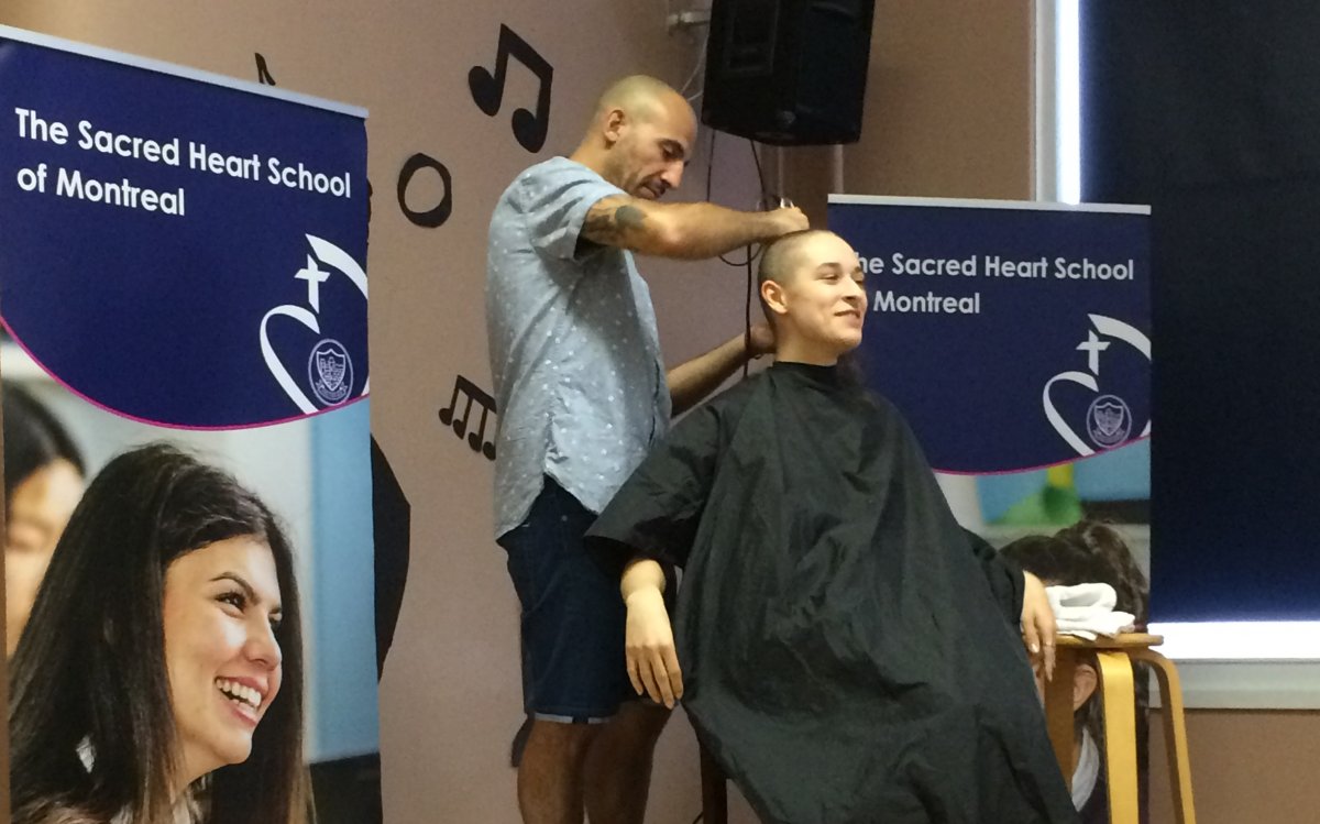 Olivia Iorio has her head shaven to raise money for cancer, Monday, May 29, 2017.