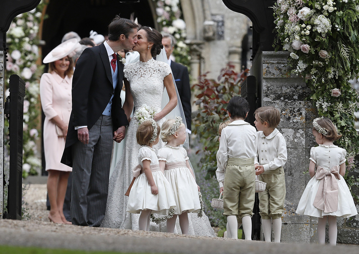 Pippa Middleton and James Matthews kiss after their wedding at St Mark’s Church in Englefield, England Saturday, May 20, 2017.