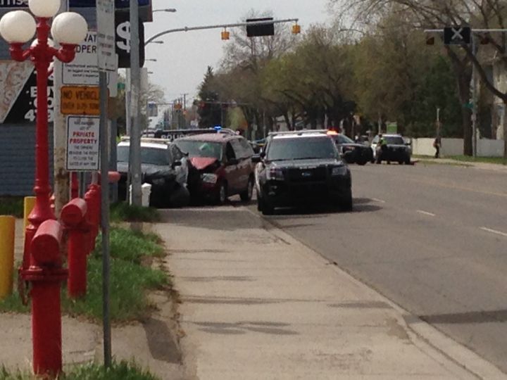 An Edmonton police officer was struck by a police cruiser after a van struck several police vehicles in the area of 58 Street and 118 Avenue Friday, May 12, 2017.