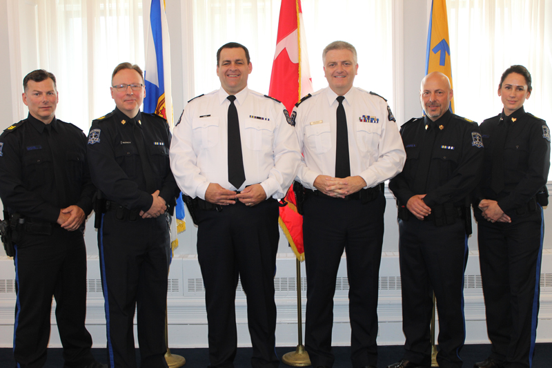 Six Halifax police officers smile for a photo following a promotional ceremony Wednesday, May 31, 2017. From left, Sgt. John McNeil, Staff Sgt. Mark MacDonald, Inspector Richard Lane, Deputy Chief Robin McNeil, Staff Sgt. Ron Legere and Sgt. Kathryn Willett. Not pictured, Inspector Penny Hart. 