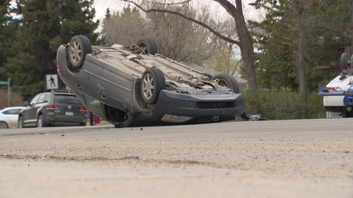 Distracted driving ticket for woman who rolled her car after sideswiping a parked vehicle in Saskatoon.