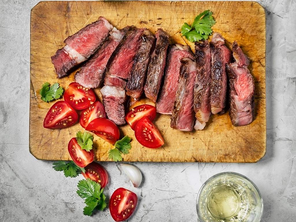 Grilled steak with grilled or fresh vegetables and complex carbohydrates makes for a delicious and health-conscious brunch.