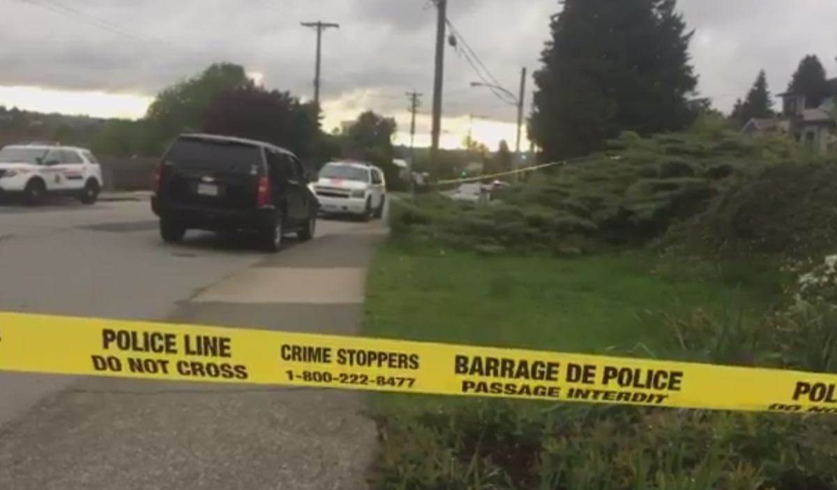 Police surround a residential neighbourhood in Burnaby after two people were shot.