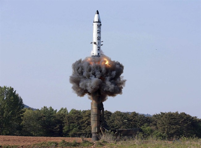 In this undated photo distributed by the North Korean government Monday, May 22, 2017, a solid-fuel "Pukguksong-2" missile lifts off during its launch test at an undisclosed location in North Korea.