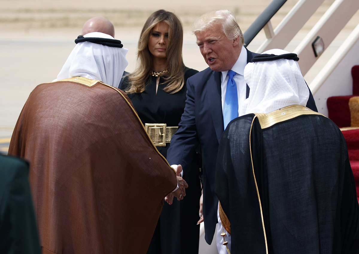 U.S. President Donald Trump, accompanied by first lady Melania Trump, shakes hands with Saudi King Salman during a welcome ceremony at the Royal Terminal of King Khalid International Airport, Saturday, May 20, 2017, in Riyadh.
