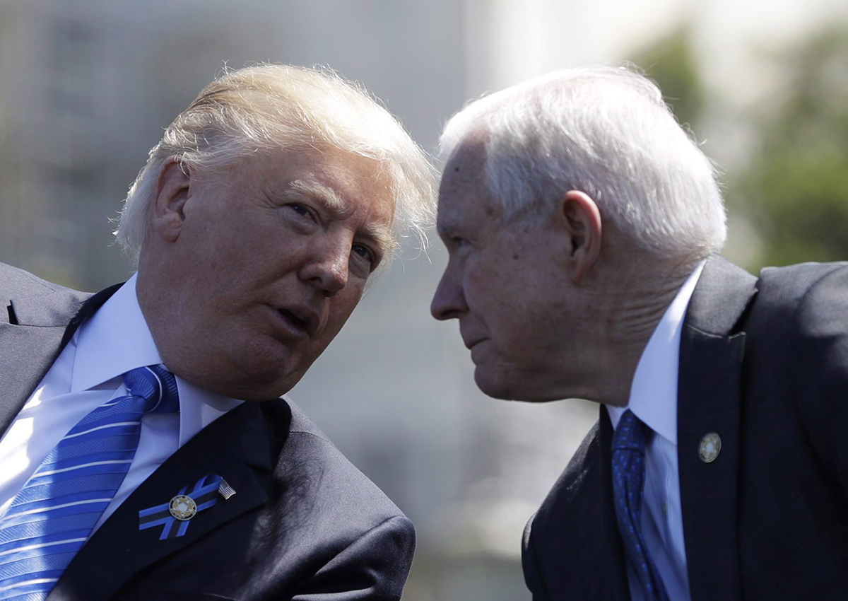 President Donald Trump talks with Attorney General Jeff Sessions, gestures before speaking at the 36th Annual National Peace Officers' memorial service, Monday, May 15. 2017, on Capitol Hill in Washington. 