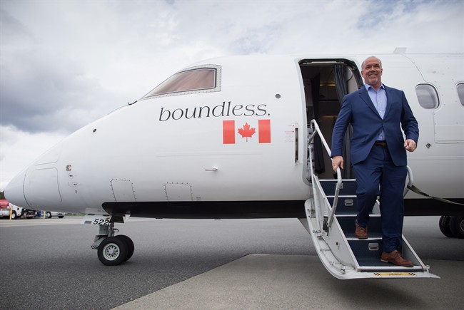 NDP Leader John Horgan steps off a plane after arriving in Nanaimo, B.C., on Friday May 5, 2017, for campaign stops on Vancouver Island. A provincial election will be held on Tuesday. 