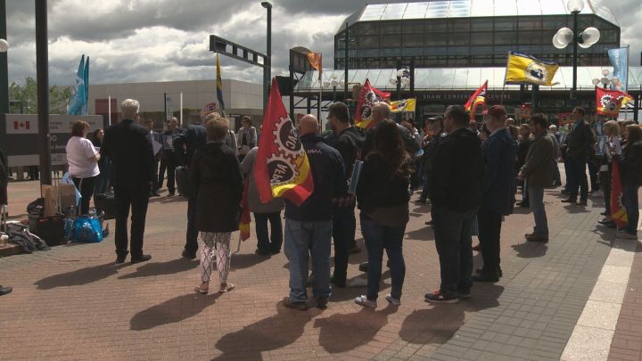 Dozens of protesters gathered at Canada Place in downtown Edmonton on Thursday to voice their displeasure over the federal government's plan to move an immigration processing centre from Vegreville to Alberta's capital.