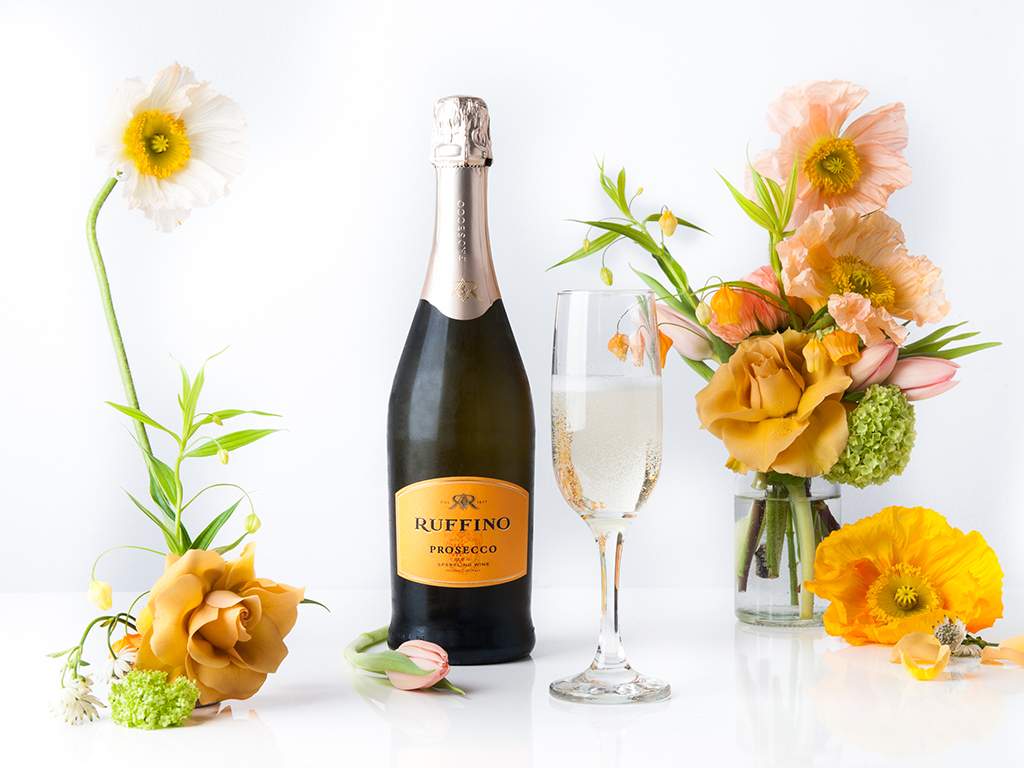 Coordinating your flowers to a label on a wine bottle is an interesting way to showcase both.