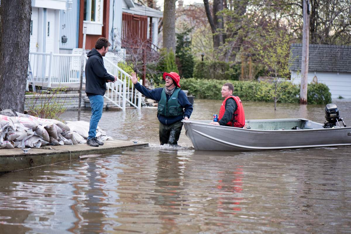 Volunteers help flood victims in Île Bizard in Montreal's West Island.