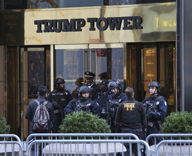 In this Nov. 17, 2016 file photo, security personnel stand at the front entrance of Trump Tower in New York. 