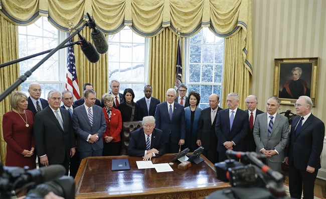 In this March 13, 2017, file photo, President Donald Trump speaks before signing an executive order on “Comprehensive Plan for Reorganizing the Executive Branch” in the Oval Office of the White House in Washington.