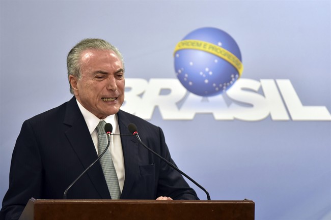 Brazil's President Michel Temer says he will fight allegations that he endorsed the paying of hush money to an ex-lawmaker jailed for corruption, during a national address at the Planalto presidential palace in Brasilia, Brazil,.