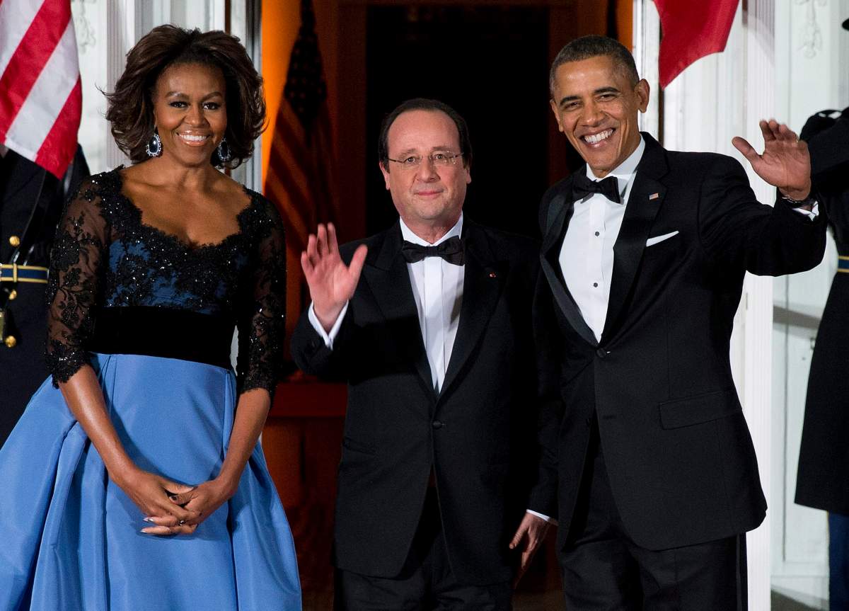 Former first lady Michelle Obama, left, and then-president Barack Obama welcome former French president François Hollande for a State Dinner at the North Portico of the White House on Tuesday, Feb. 11, 2014, in Washington.
