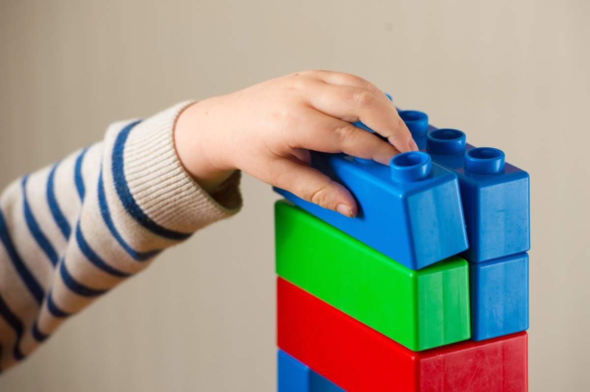 File photo dated 24/01/16 of a preschool age child playing with plastic building blocks. 