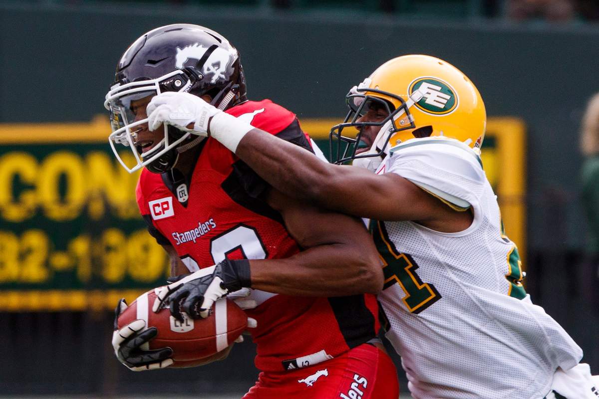 Calgary Stampeders Kamar Jorden (88) Edmonton Eskimos Brandyn Thompson (24) during first half CFL pre-season action in Edmonton, Alta., on Sunday June 11, 2017. THE CANADIAN PRESS/Amber Bracken