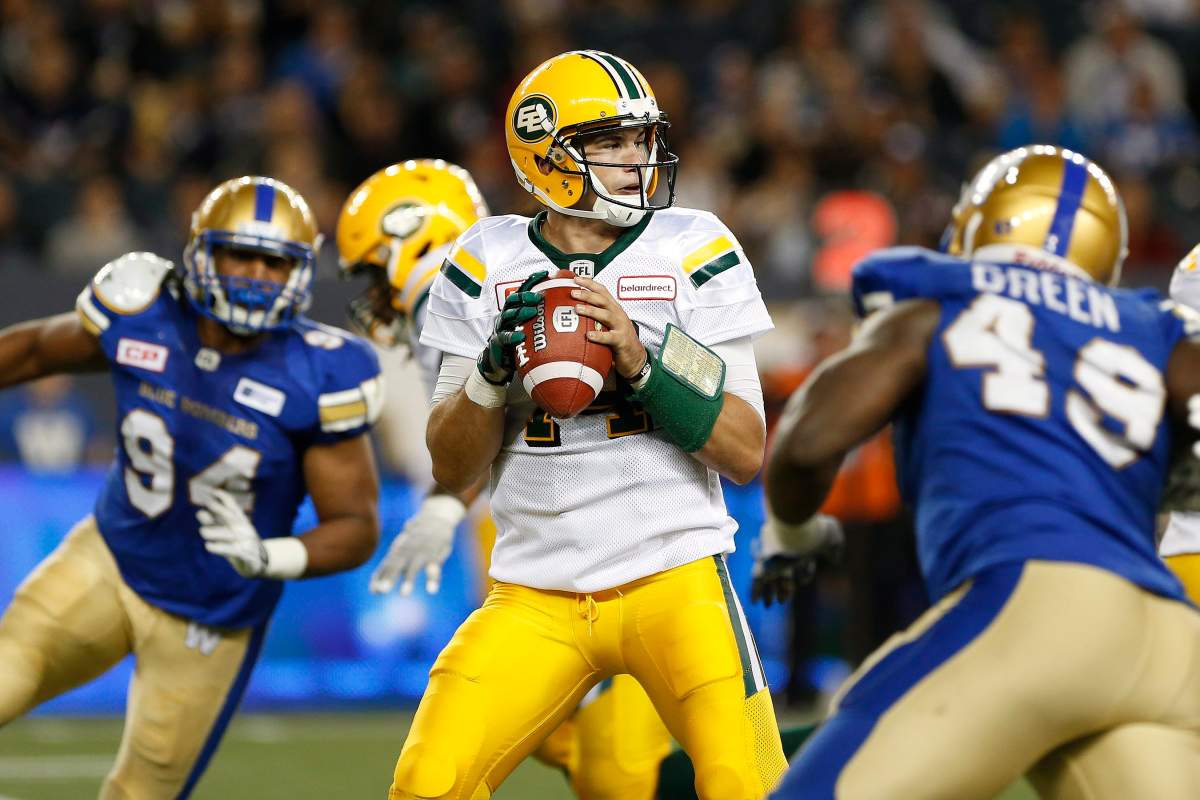 Edmonton Eskimos quarterback Zach Kline (14) throws against the Winnipeg Blue Bombers during the second half of CFL action in Winnipeg on June 15, 2017.